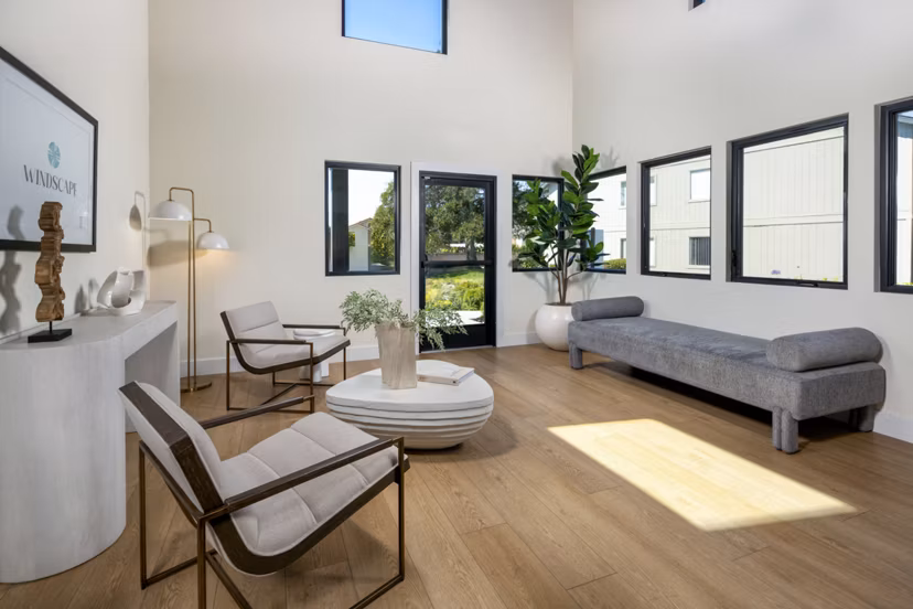 Modern clubhouse and leasing office at Windscape Village Apartments featuring stylish design and comfortable seating areas