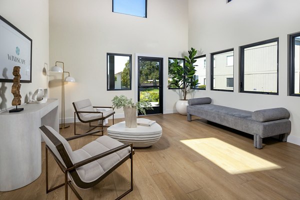 Modern clubhouse and leasing office at Windscape Village Apartments featuring stylish design and comfortable seating areas