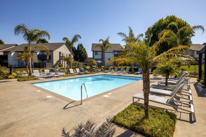 Sparkling outdoor pool at Windscape Village Apartments offering luxury relaxation