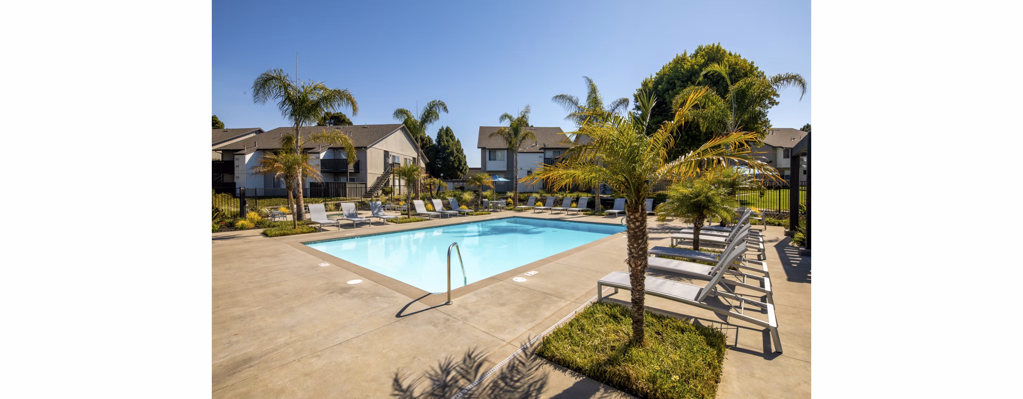 Sparkling outdoor pool at Windscape Village Apartments offering luxury relaxation