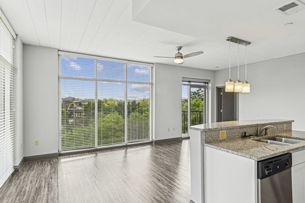 Living room at Rivers Edge Apartments featuring modern luxury design elements and spacious layout for comfortable living