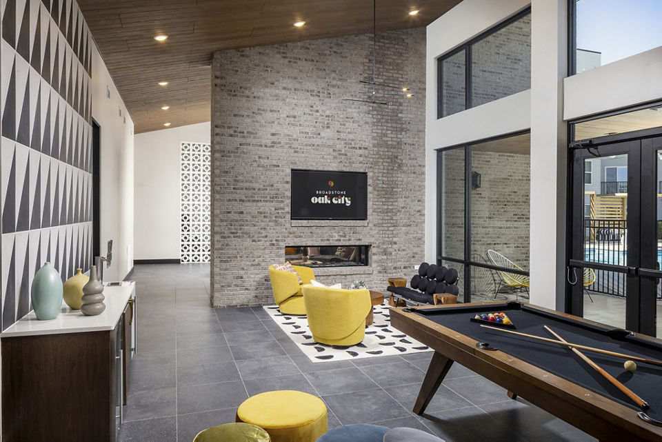 Chic clubhouse with modern furnishings at Broadstone Oak City Apartments, perfect for relaxation and socializing