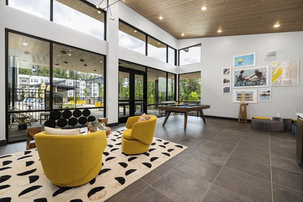 Clubhouse with stylish lounge seating and modern decor at Broadstone Oak City Apartments