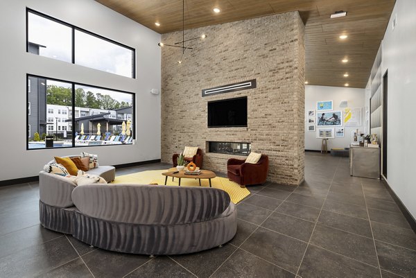 Modern clubhouse with lounge seating at Broadstone Oak City Apartments, ideal for social gatherings and resident events