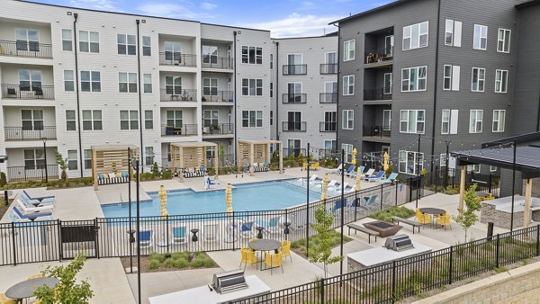 Modern pool area with lounge seating at Broadstone Oak City Apartments