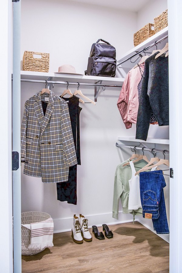 Spacious bedroom closet with custom shelving at Novel Cary Apartments, ideal for organizing luxury wardrobes in a Greystar community