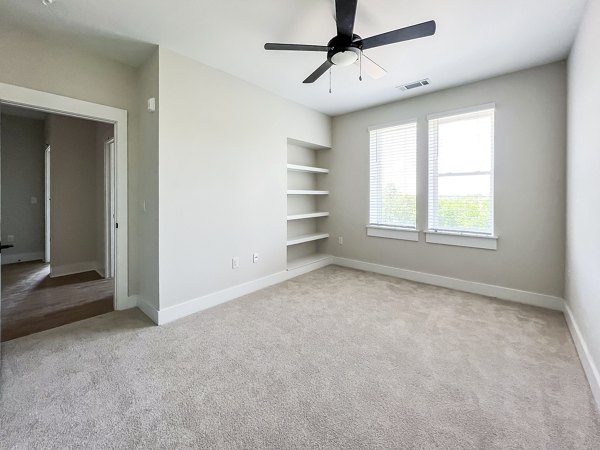 Spacious bedroom closet with ample shelving and storage in Novel Cary Apartments