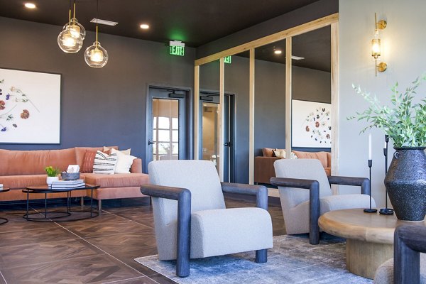 Clubhouse lobby featuring modern seating and decor at Novel Cary Apartments, a Greystar luxury community