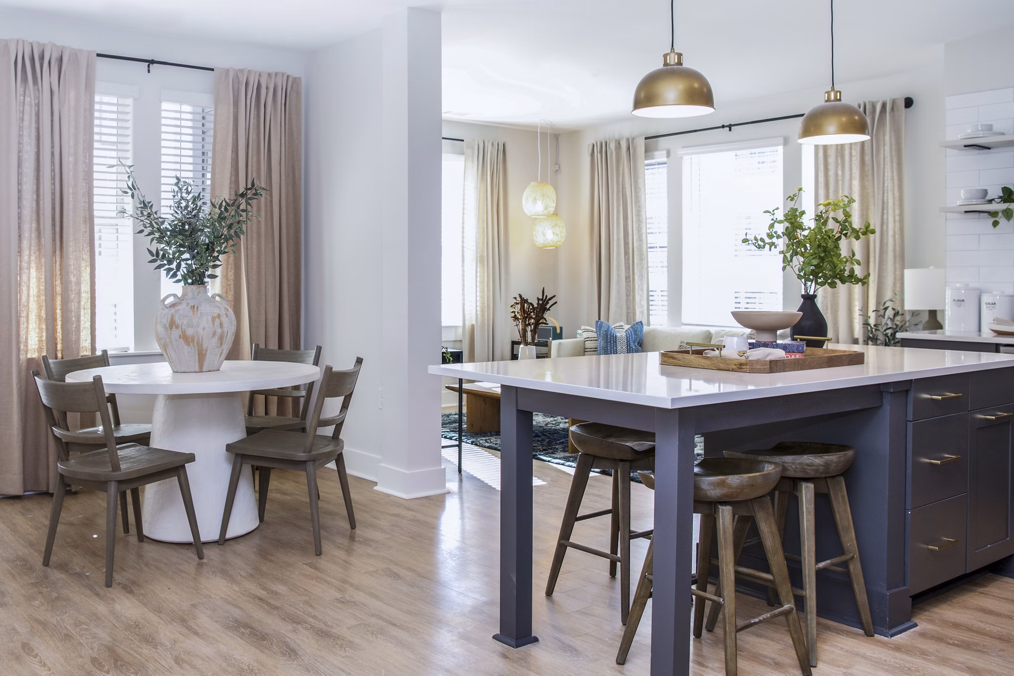 Dining room featuring modern decor and ample seating in Novel Cary Apartments