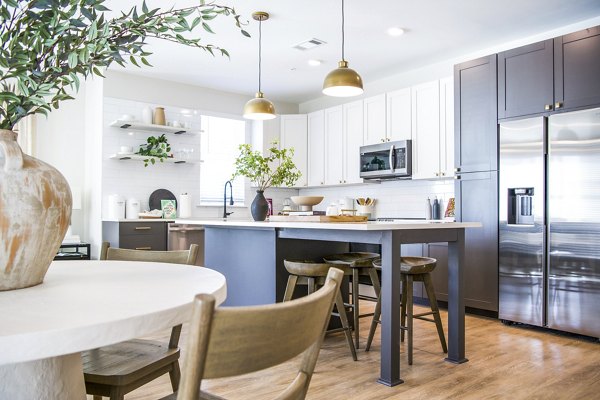 Dining room with elegant table settings and modern decor at Novel Cary Apartments, part of Greystar's luxury apartment offerings