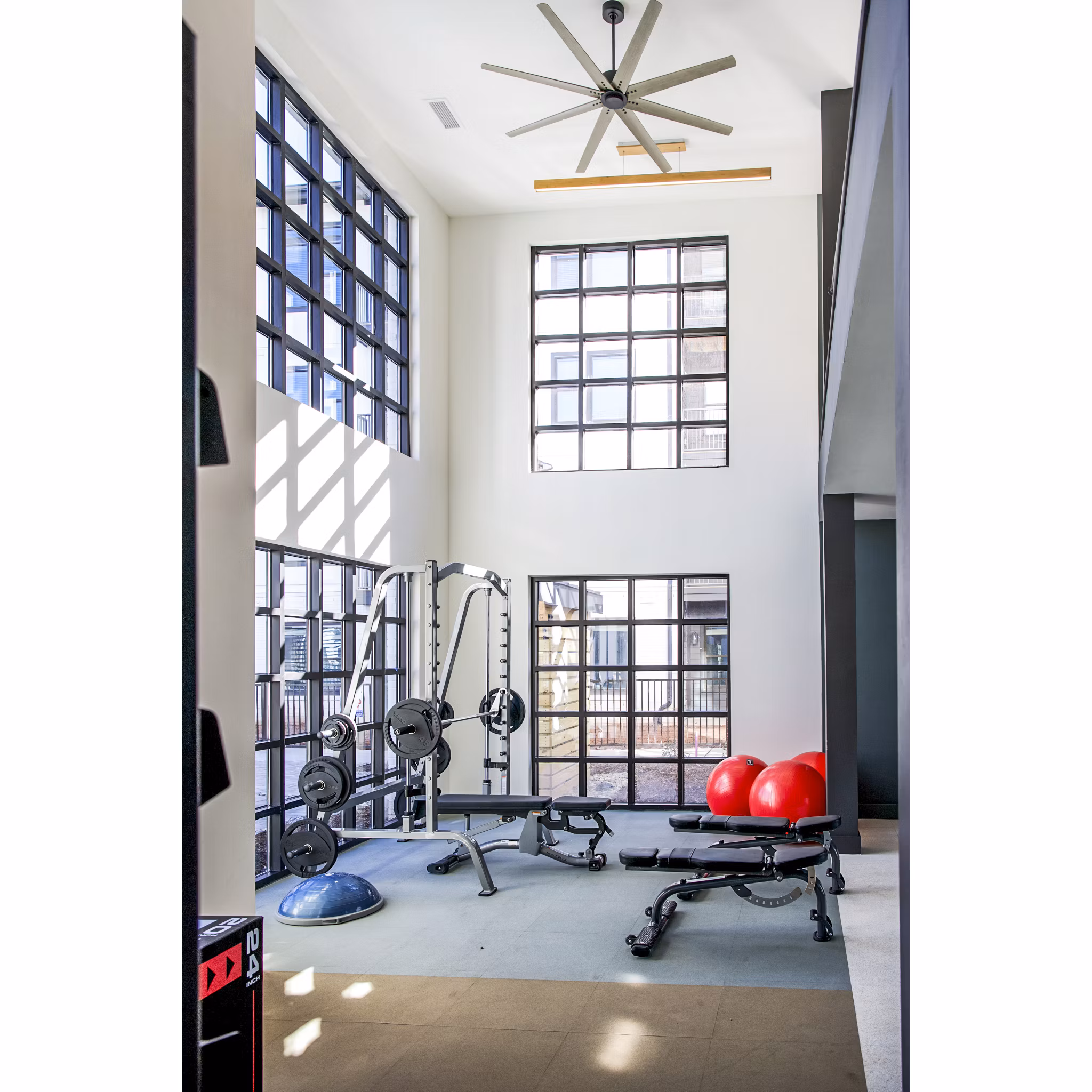 Modern fitness center with state-of-the-art equipment at Novel Cary Apartments, offering luxury living and wellness amenities for residents