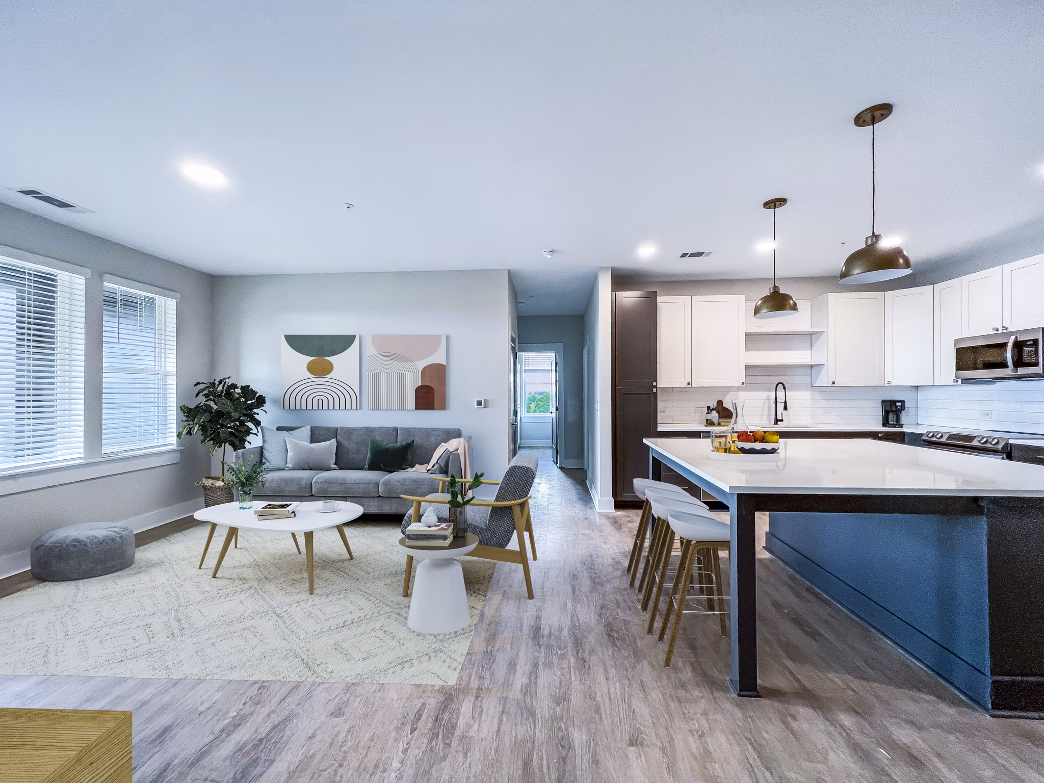 Elegant living room with contemporary decor at Novel Cary Apartments, featuring stylish furnishings and ample natural light