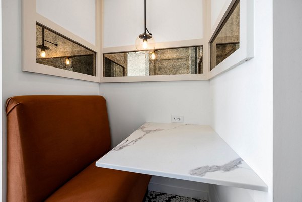 Clubhouse with modern design features at The Pace at Holding Village Apartments, offering luxury amenities for community events