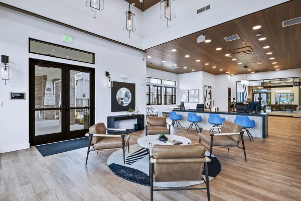 Clubhouse lounge area with modern decor at Viviano at Riverton Apartments