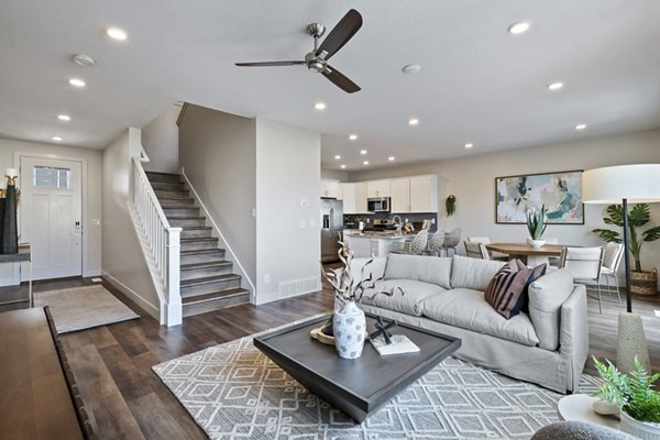 Modern living room with stylish furnishings at Viviano at Riverton Apartments luxury community