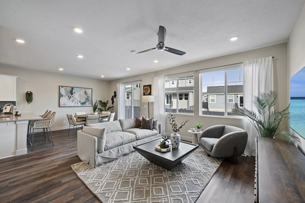 Spacious living room with modern furnishings at Viviano at Riverton Apartments