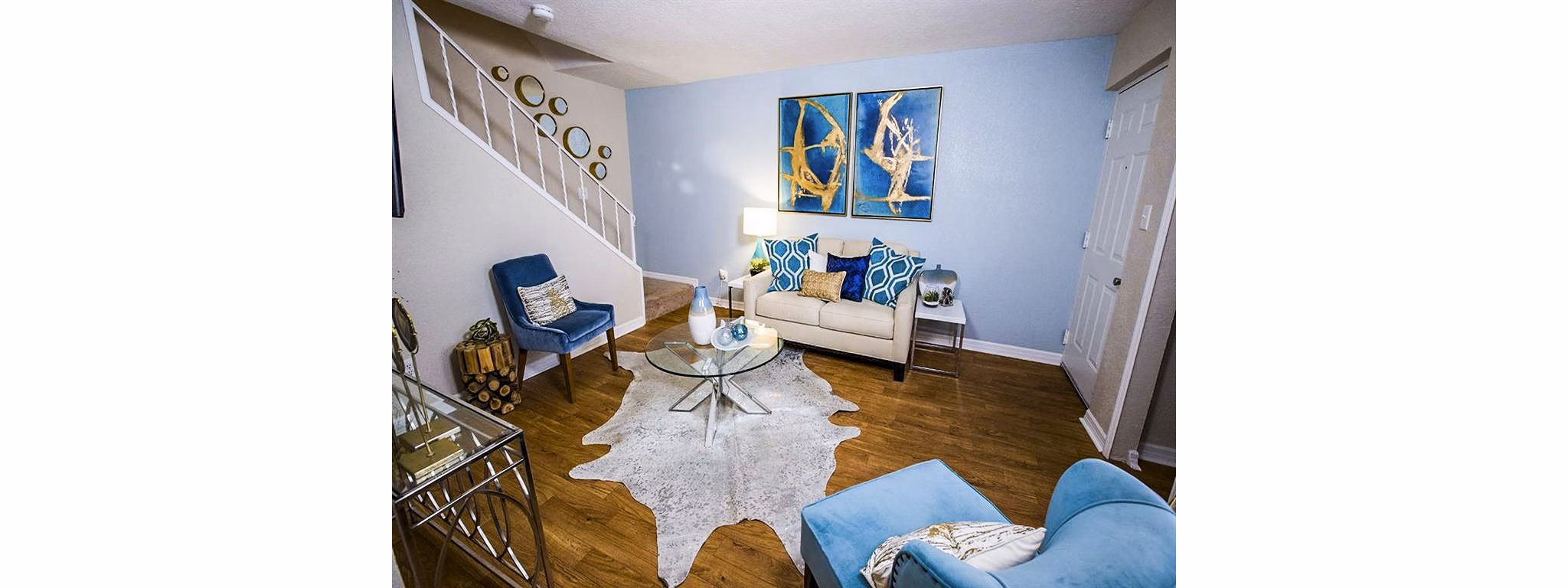 Spacious living room with modern decor at The Laurels Apartments in luxury Greystar community