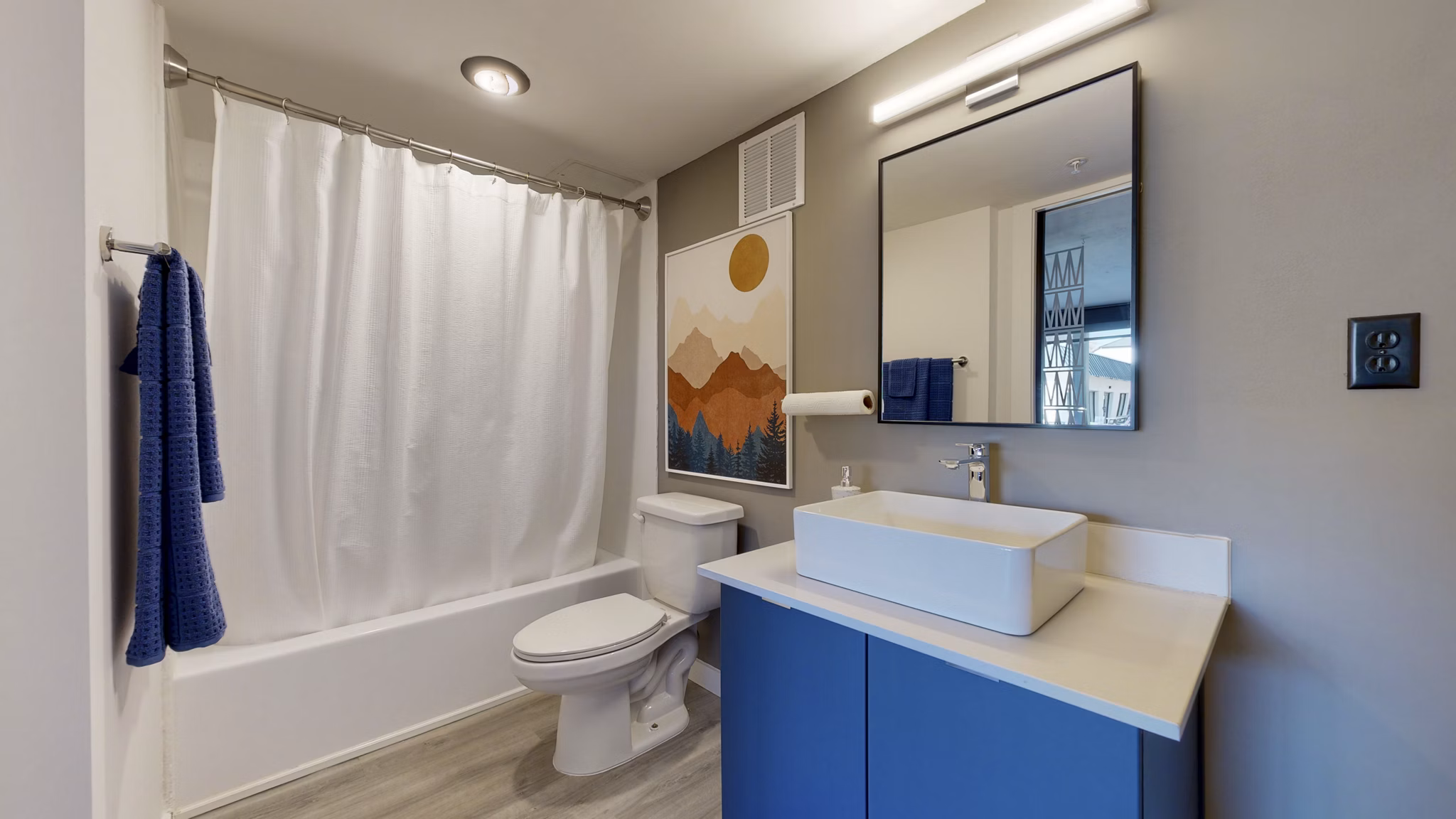 Bathroom featuring sleek modern fixtures at River Roost Apartments, a Greystar luxury property