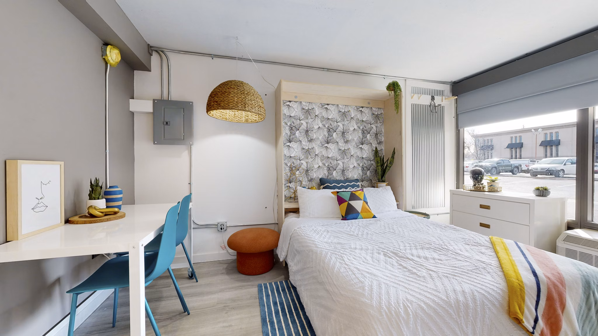 Cozy bedroom with modern decor at River Roost Apartments, luxurious living spaces