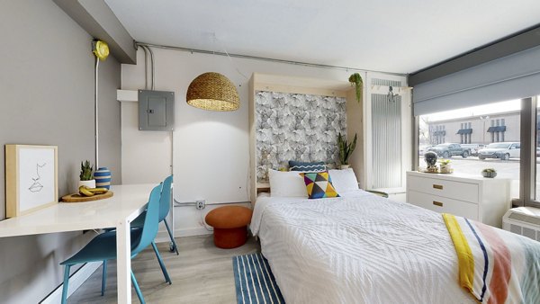 Cozy bedroom with modern decor at River Roost Apartments, luxurious living spaces