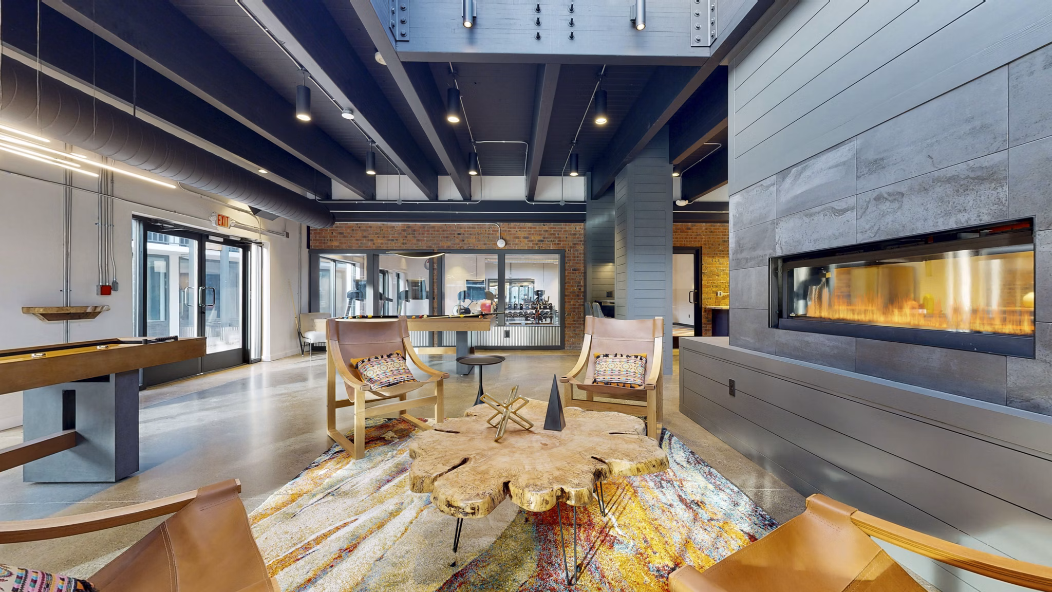 Clubhouse featuring spacious lounge areas at River Roost Apartments in a luxurious setting