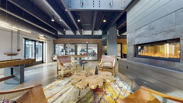 Clubhouse featuring spacious lounge areas at River Roost Apartments in a luxurious setting