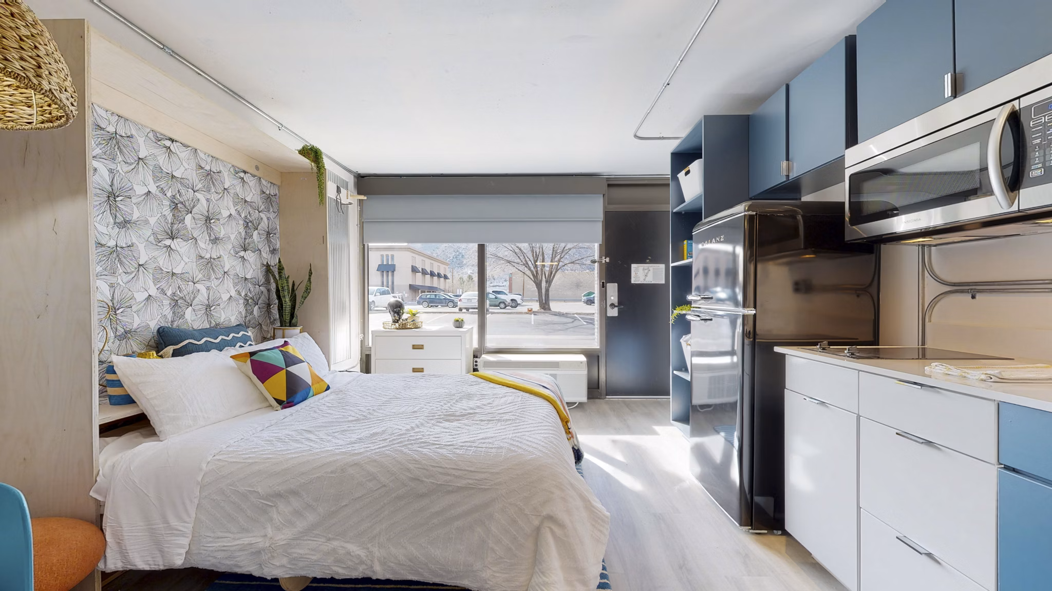 Modern kitchen with stainless steel appliances in River Roost Apartments