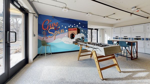 Modern laundry facility with energy-efficient machines at River Roost Apartments