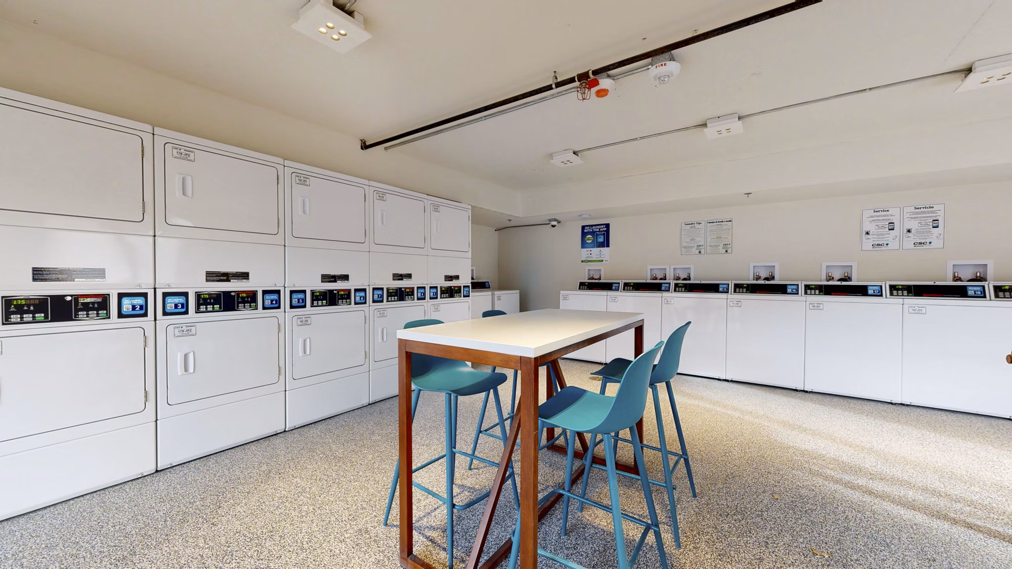 Modern laundry facility at River Roost Apartments featuring top-of-the-line washers and dryers for convenient tenant use