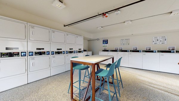 Modern laundry facility at River Roost Apartments featuring top-of-the-line washers and dryers for convenient tenant use
