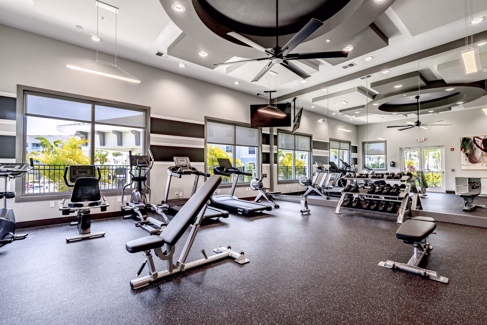 Modern fitness center with state-of-the-art equipment at The Palms at Cape Coral Apartments