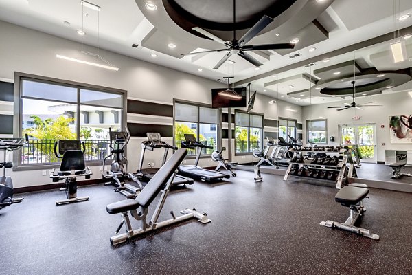 Modern fitness center with state-of-the-art equipment at The Palms at Cape Coral Apartments