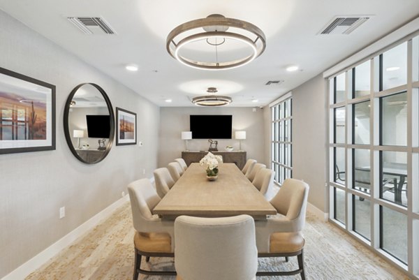 Clubhouse meeting facility with modern furnishings at Overture North Scottsdale Apartments for community events and gatherings