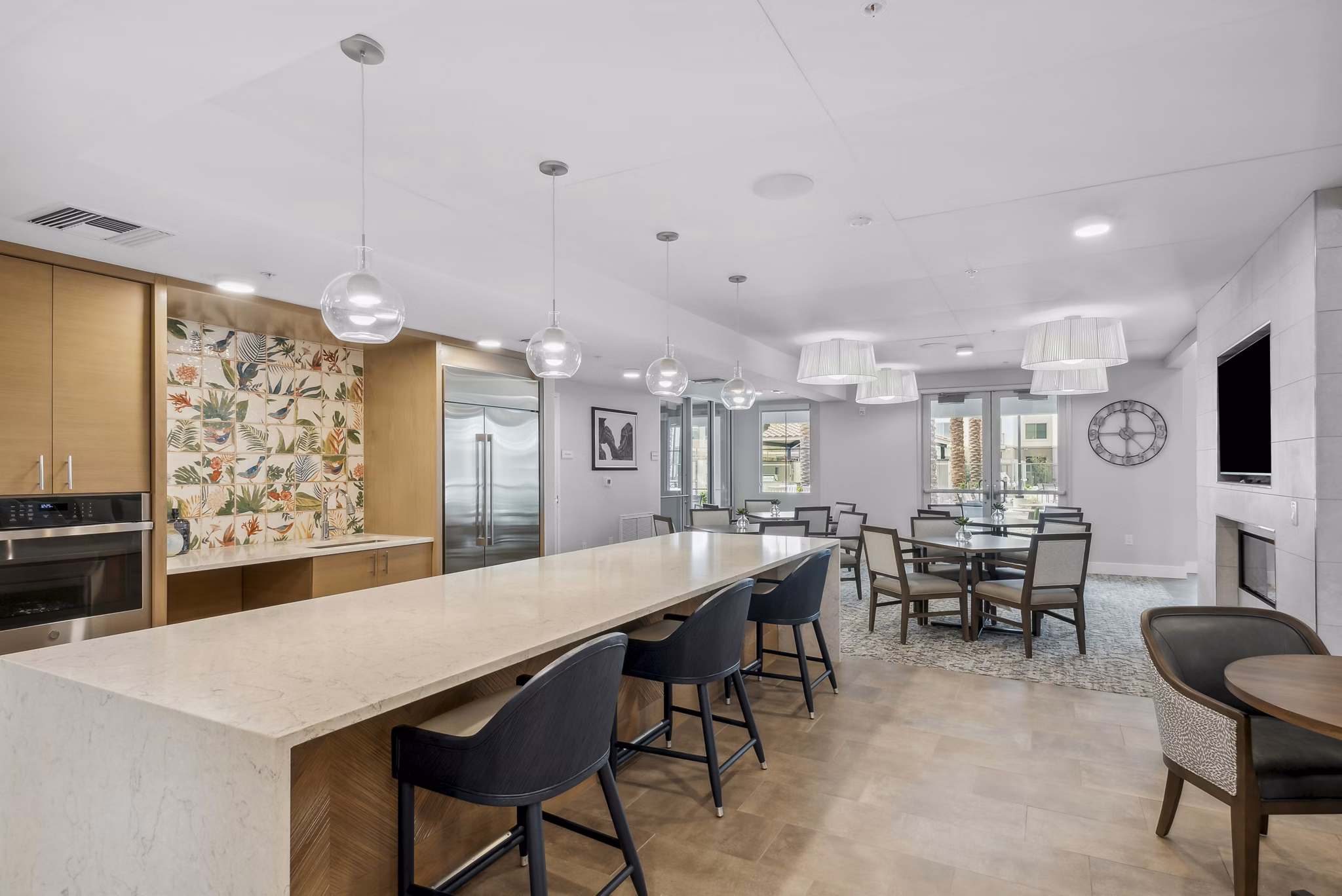 Modern clubhouse kitchen with stainless steel appliances at Overture North Scottsdale Apartments, offering luxury living spaces