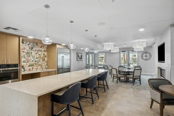 Modern clubhouse kitchen with stainless steel appliances at Overture North Scottsdale Apartments, offering luxury living spaces