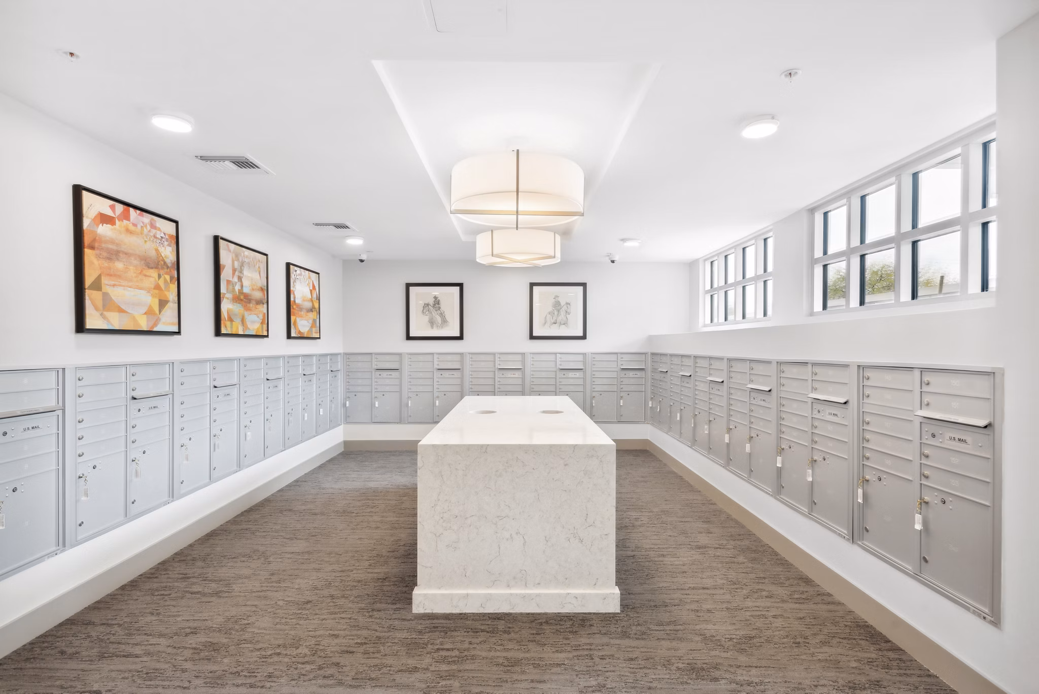 Clubhouse mail room with modern design elements at Overture North Scottsdale Apartments, offering convenience and style for residents