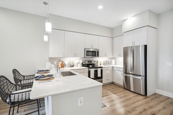 kitchen with stainless steel appliances at Overture North Scottsdale Apartments, offering modern luxury living in Scottsdale