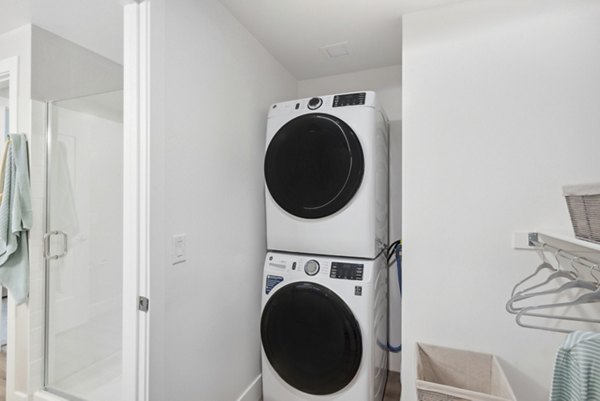 Modern laundry room with energy-efficient machines at Overture North Scottsdale Apartments