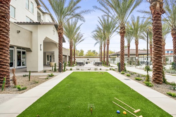 Outdoor recreational area with seating and shade structures at Overture North Scottsdale Apartments