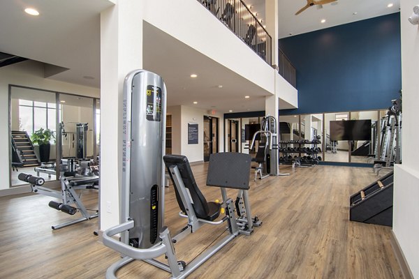 Fitness center with modern equipment at The Foundry at Mashburn Village apartments