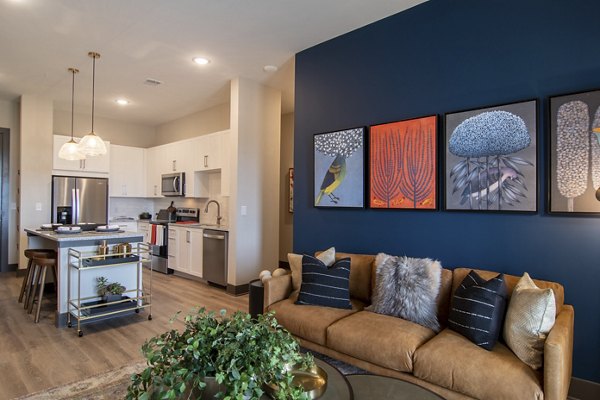 Spacious living room with modern decor at The Foundry at Mashburn Village Apartments