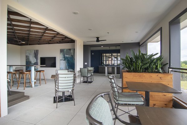 Stylish patio with modern seating at The Foundry at Mashburn Village Apartments, perfect for relaxation and outdoor gatherings