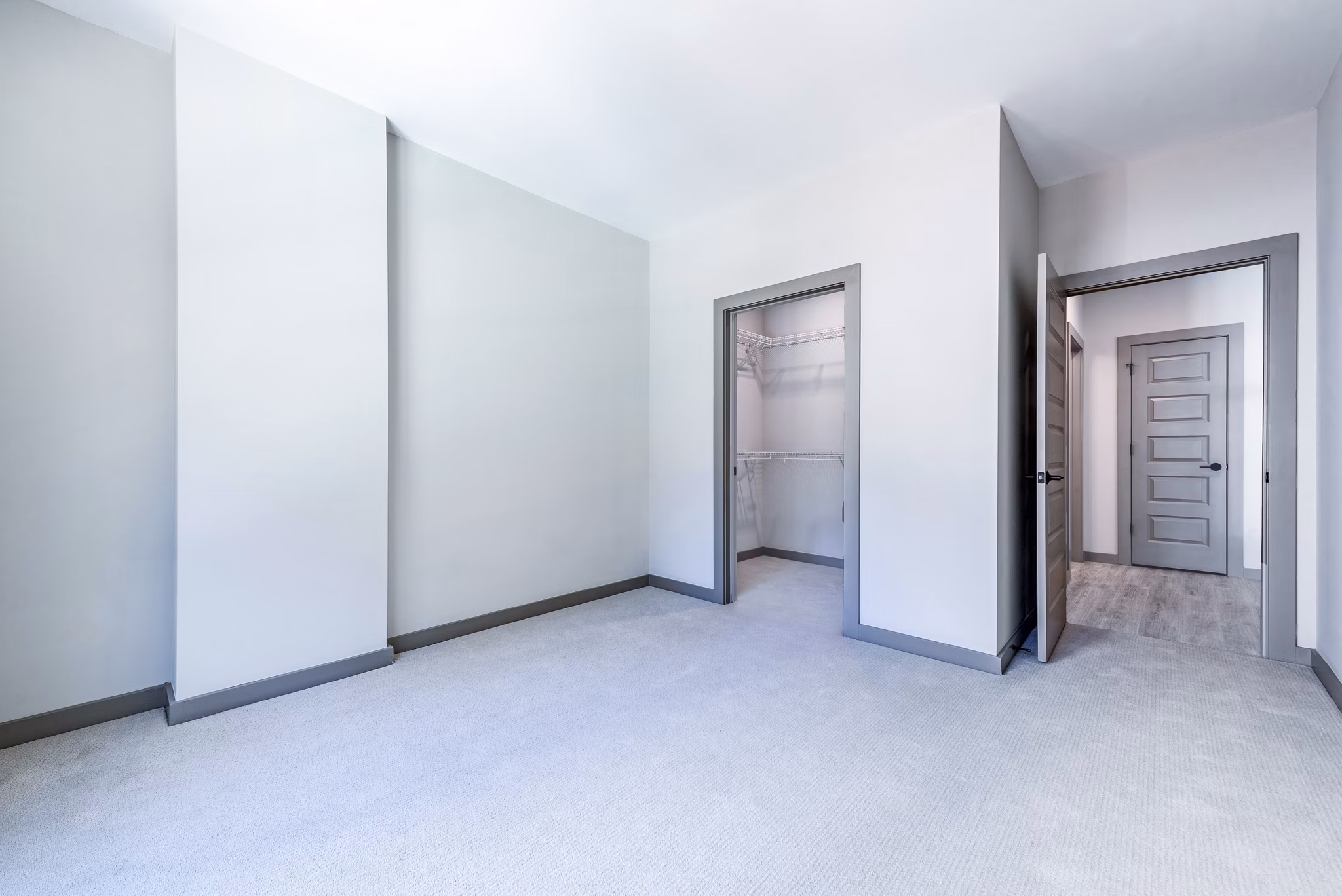 Marlow Apartments: Cozy bedroom with modern furnishings in upscale luxury apartment community