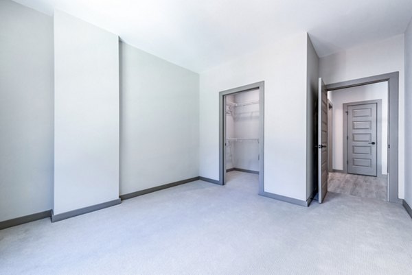 Marlow Apartments: Cozy bedroom with modern furnishings in upscale luxury apartment community