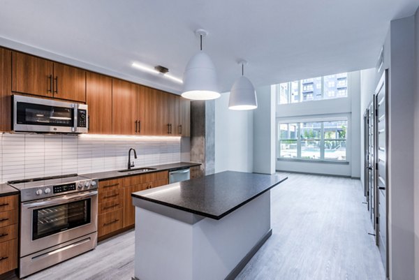 Modern kitchen with stainless steel appliances at Marlow Apartments