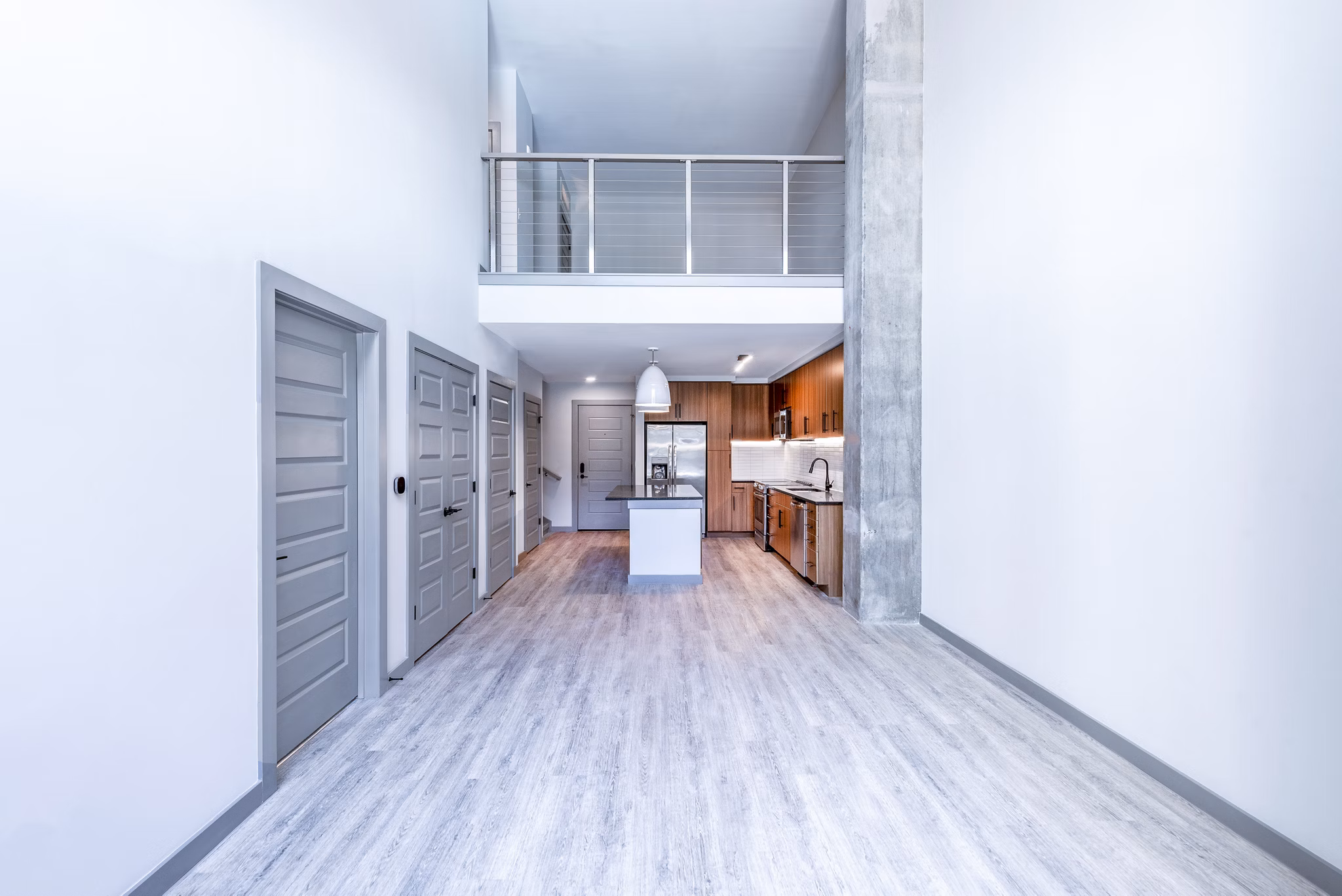 Living room with modern furniture and large windows at Marlow Apartments