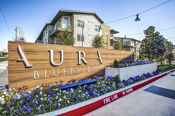Signage displaying Bluffs at Midway Hollow luxury apartments entrance