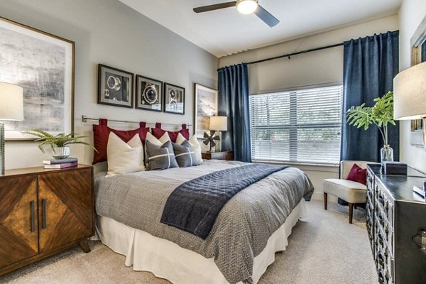 Cozy bedroom with modern decor at Bluffs at Midway Hollow Apartments