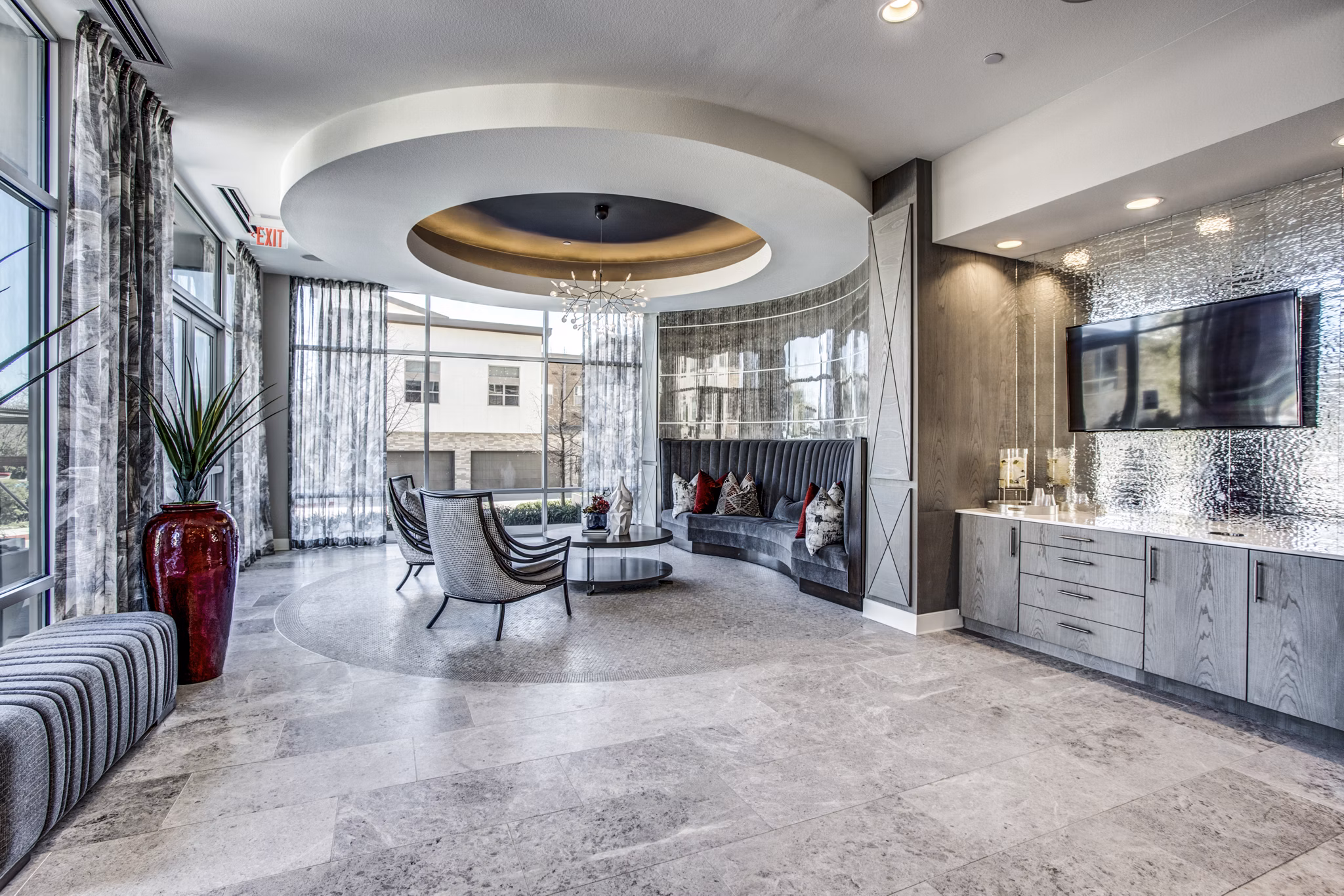 Clubhouse featuring elegant design and spacious seating at Bluffs at Midway Hollow Apartments