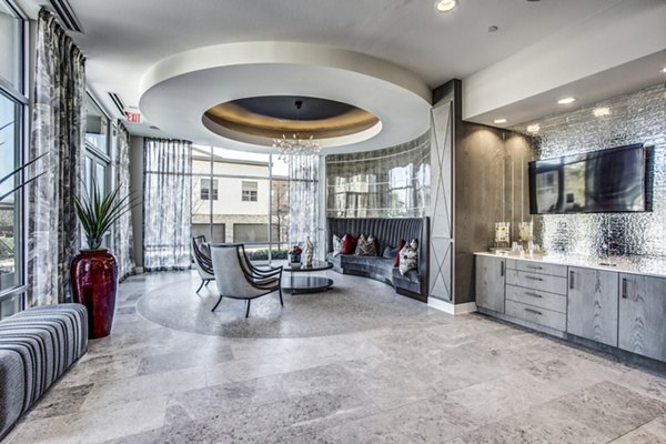 Clubhouse featuring elegant design and spacious seating at Bluffs at Midway Hollow Apartments